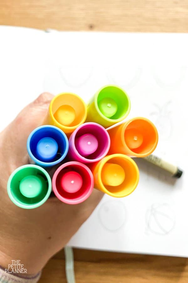 Caps of rainbow colored markers