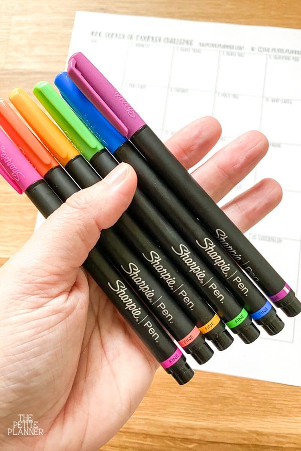 Hand hold Sharpie Art pens in rainbow colors